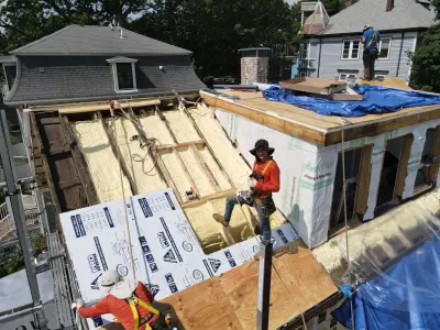 James Hardie white lap siding with black windows on a Boston, MA home - photo 23