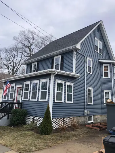 Medium blue CertainTeed lap siding with white trim on a Boston, MA home