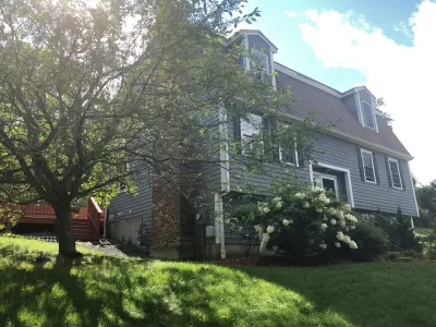 Charcoal CertainTeed vinyl siding on a gambrel Dutch colonial in Danvers, MA - photo 11