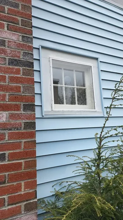 Deep blue James Hardie lap siding with white trim in Dedham, MA - photo 13
