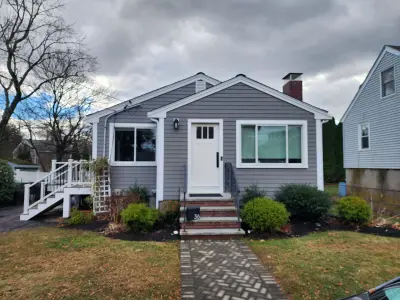 Gray fiber cement siding with composite deck and stairs in Dedham, MA - photo 6