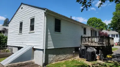 Gray fiber cement siding with composite deck and stairs in Dedham, MA - photo 32