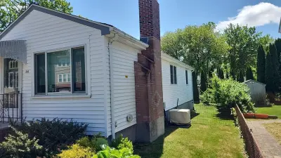 Gray fiber cement siding with composite deck and stairs in Dedham, MA - photo 33
