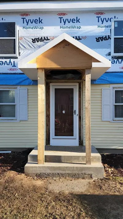 Deep navy James Hardie lap siding with white trim on a colonial in Framingham, MA - photo 23