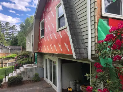 Exterior insulation going on before James Hardie siding in Framingham, MA