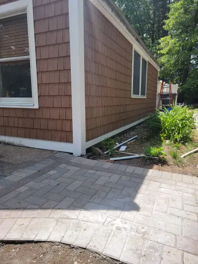 Cedar-brown shake profile siding on a poolside elevation in Framingham, MA - photo 12