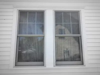 CertainTeed white vinyl siding and new double-hung windows in Framingham, MA
