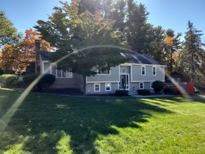 James Hardie fiber cement siding in warm taupe on a Marlborough, MA home - photo 5