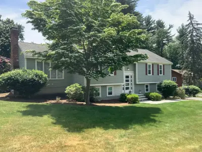 James Hardie fiber cement siding in warm taupe on a Marlborough, MA home - photo 19