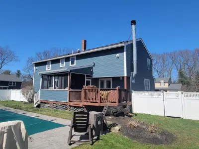 Slate blue James Hardie lap and shingle siding on a home in Maynard, MA - photo 5