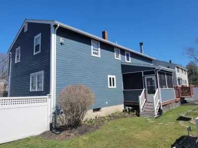 Slate blue James Hardie lap and shingle siding on a home in Maynard, MA - photo 7