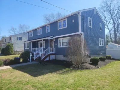 Slate blue James Hardie lap and shingle siding on a home in Maynard, MA - photo 8