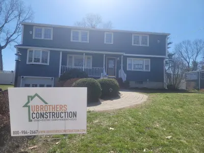 Slate blue James Hardie lap and shingle siding on a home in Maynard, MA - photo 11