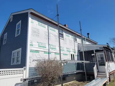 Slate blue James Hardie lap and shingle siding on a home in Maynard, MA - photo 14