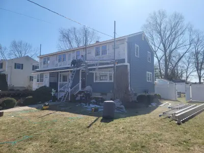 Slate blue James Hardie lap and shingle siding on a home in Maynard, MA - photo 15