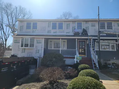 Slate blue James Hardie lap and shingle siding on a home in Maynard, MA - photo 16