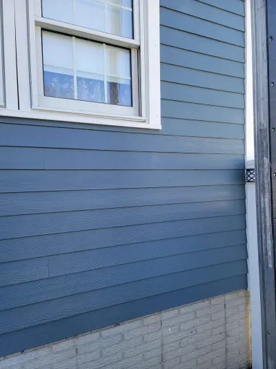 Slate blue James Hardie lap and shingle siding on a home in Maynard, MA - photo 17