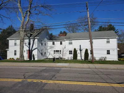 White James Hardie clapboard siding on an antique colonial in Medfield, MA