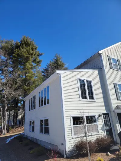 Deep slate gray James Hardie lap siding with white trim in Medfield, MA - photo 10