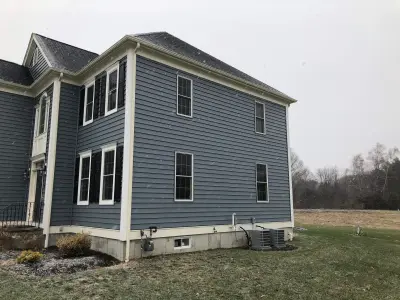 Alside blue-gray siding with cream trim on a Millis, MA colonial - photo 25