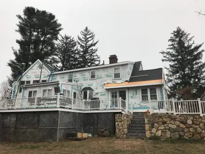 Olive green James Hardie lap siding with black windows in Natick, MA - photo 12