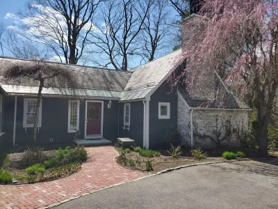 Near-black James Hardie lap siding with white trim on a Newton, MA home - photo 5