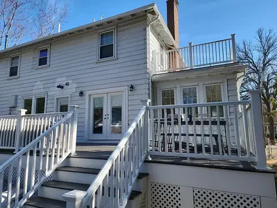Medium blue CertainTeed vinyl siding on a home and garage in Newton, MA - photo 10