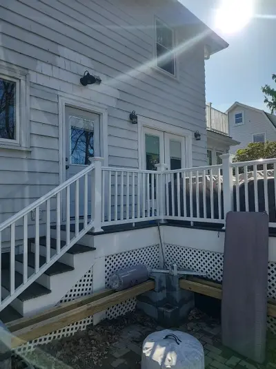 Medium blue CertainTeed vinyl siding on a home and garage in Newton, MA - photo 11
