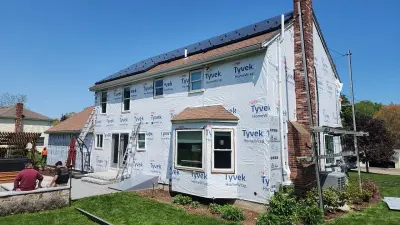 Warm white CertainTeed vinyl siding over exterior insulation in Norfolk, MA - photo 8