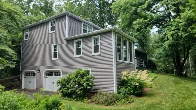 Medium gray CertainTeed vinyl siding with white trim on a home in Northborough, MA