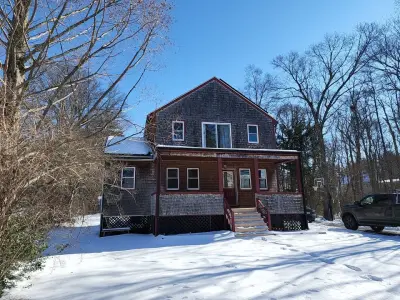 Gray-green James Hardie lap siding on a home in Stoughton, MA - photo 23