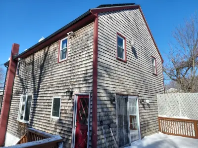 Gray-green James Hardie lap siding on a home in Stoughton, MA - photo 24