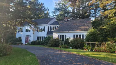 James Hardie white lap siding with black shutters in Sudbury, MA - photo 5