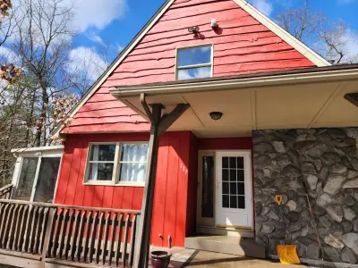 Dark blue-gray vinyl siding with beige trim on a gabled home in Upton, MA - photo 12