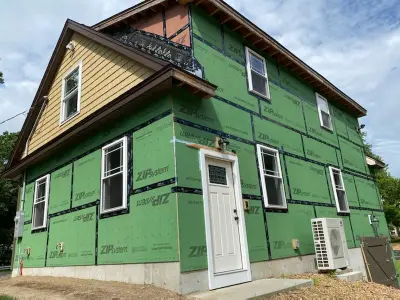 Golden tan CertainTeed siding with cedar shingle accents on a carriage garage in Westford, MA - photo 19