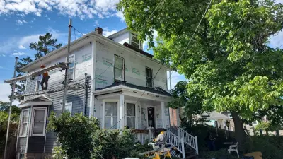 James Hardie slate blue lap siding on a porch-front home in Weymouth, MA - photo 12