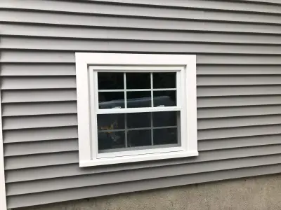 Entry and wall openings framed during a siding project in Woburn, MA - photo 12