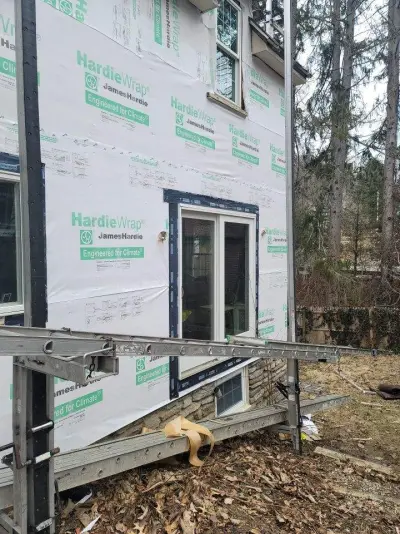 James Hardie slate blue siding with custom arched trim in Worcester, MA - photo 32
