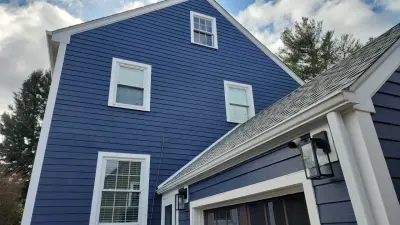 Deep navy James Hardie lap siding with white trim in Worcester, MA