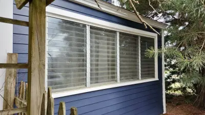 Deep navy James Hardie lap siding with white trim in Worcester, MA - photo 6