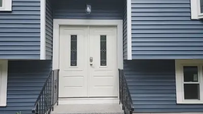 CertainTeed blue vinyl siding and new windows on a raised ranch in Canton, MA - photo 5
