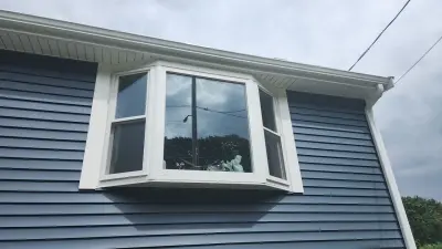 CertainTeed blue vinyl siding and new windows on a raised ranch in Canton, MA - photo 6