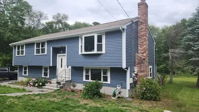 CertainTeed blue vinyl siding and new windows on a raised ranch in Canton, MA - photo 7