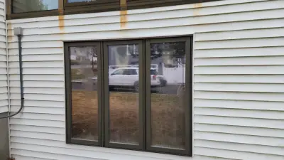 CertainTeed blue vinyl siding and new windows on a raised ranch in Canton, MA - photo 16