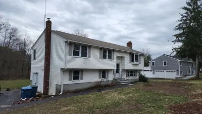 CertainTeed blue vinyl siding and new windows on a raised ranch in Canton, MA - photo 18