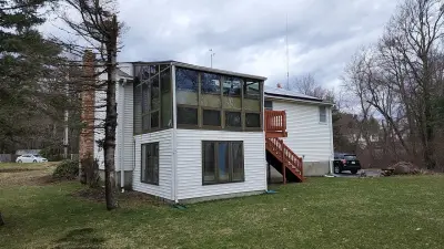 CertainTeed blue vinyl siding and new windows on a raised ranch in Canton, MA - photo 20