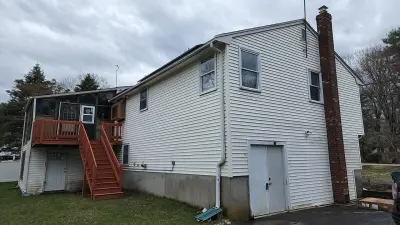 CertainTeed blue vinyl siding and new windows on a raised ranch in Canton, MA - photo 21