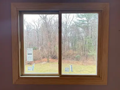 New Harvey casement windows with stained wood interior trim in Framingham, MA - photo 4
