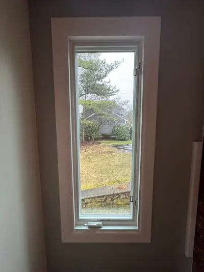 New Harvey casement windows with stained wood interior trim in Framingham, MA - photo 10