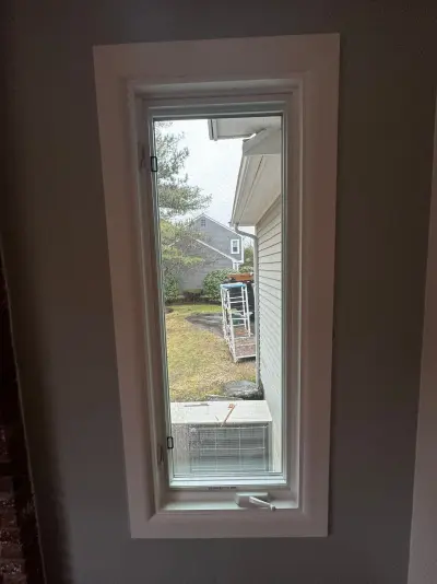 New Harvey casement windows with stained wood interior trim in Framingham, MA - photo 11